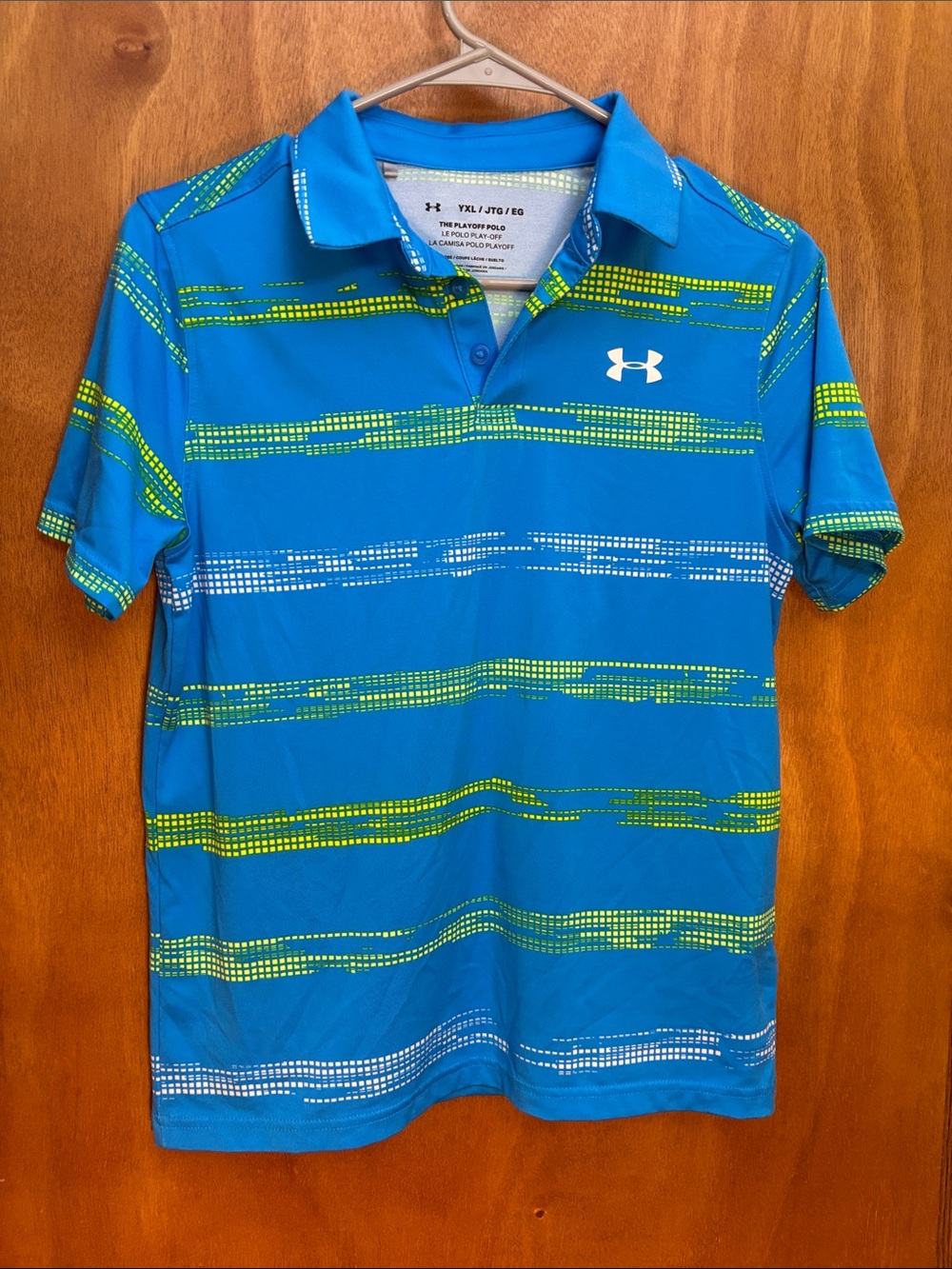 Under Armour “the playoff polo” Blue Polo with Green & White Stripe Accents